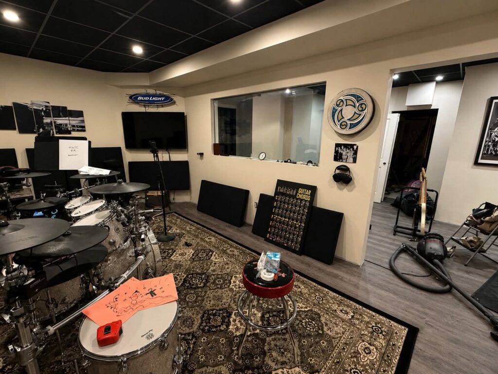 Organized maximalist home studio layout