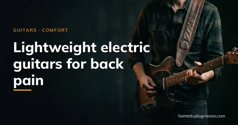 Guitarist standing in a dark studio playing a worn electric guitar on a wide brown leather shoulder strap